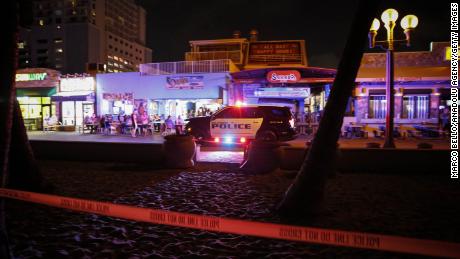 Hollywood Police cordon off the scene after an altercation ended in gunfire at the Hollywood Beach Broadwalk Monday night.