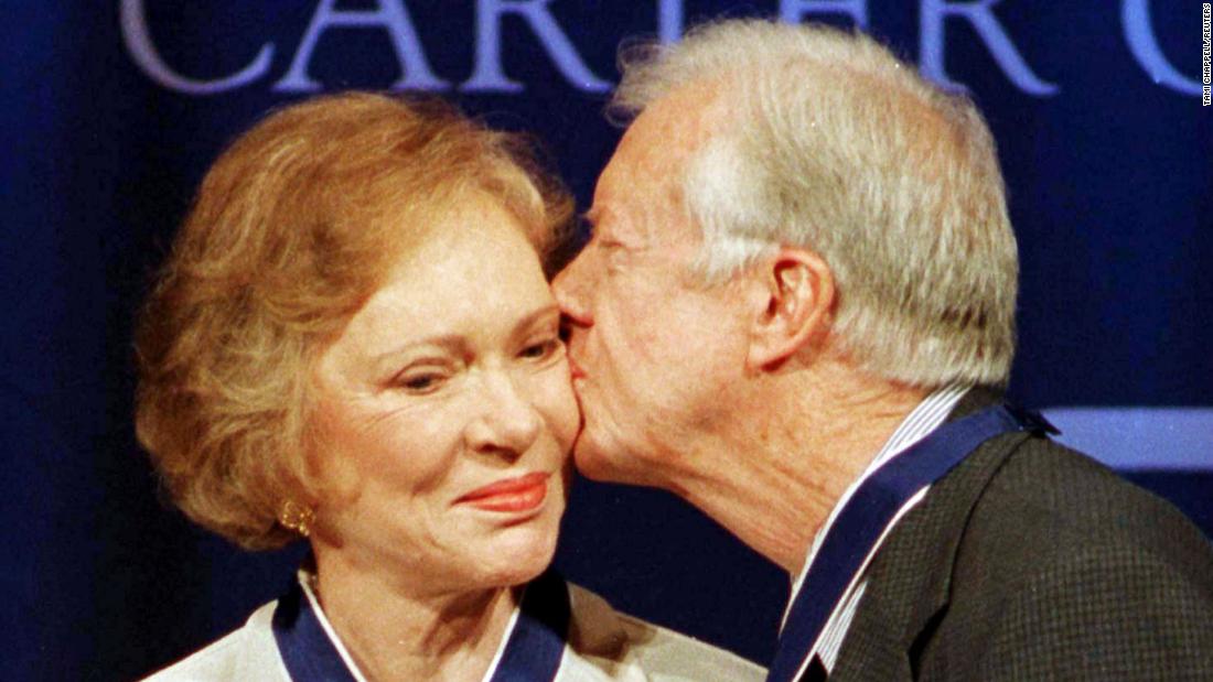 Rosalynn gets a kiss from her husband after they were awarded Presidential Medals of Freedom in 1999. The Carters were presented with the medals for the work they have done since leaving the White House in 1980.