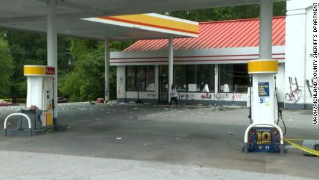 The convenience store owned by the man who shot the teenager is seen Tuesday after it was looted and vandalized.