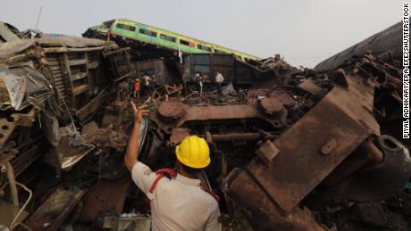 An official overseas rescue efforts at the site of the train crash in Balasore.