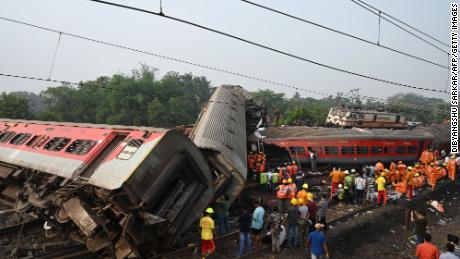 Overturned carriages in the wreckage of the crash involving two passenger trains and a freight train.