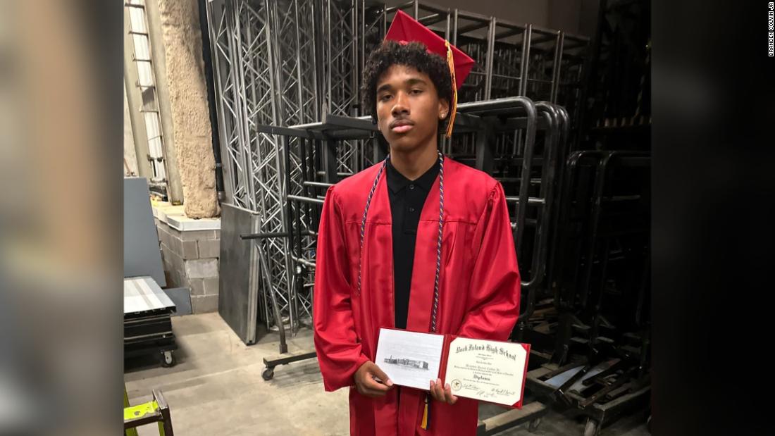 Student graduates on the day his father's body is recovered from the Davenport apartment building collapse