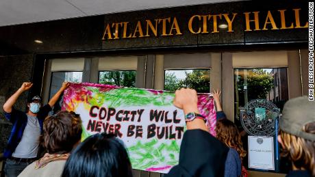 Opponents to the planned Atlanta Public Safety Training Center protest at Atlanta City Hall Monday.