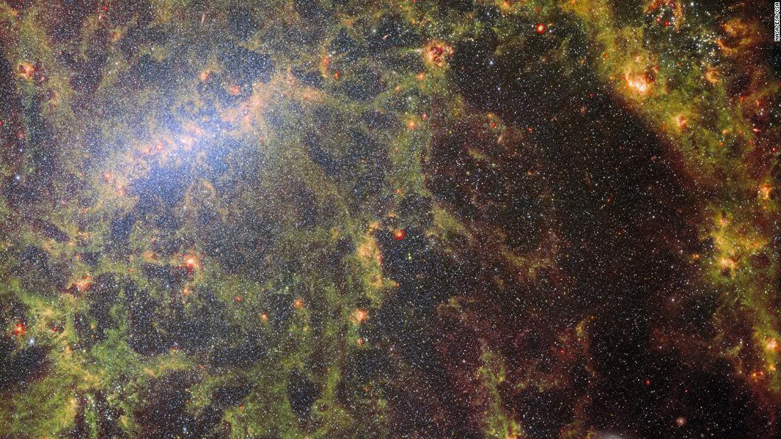 This composite image, shot from the James Webb Space Telescope&#39;s MIRI and NIRCam instruments, shows the bright clusters of stars and dust from barred spiral galaxy NGC 5068.