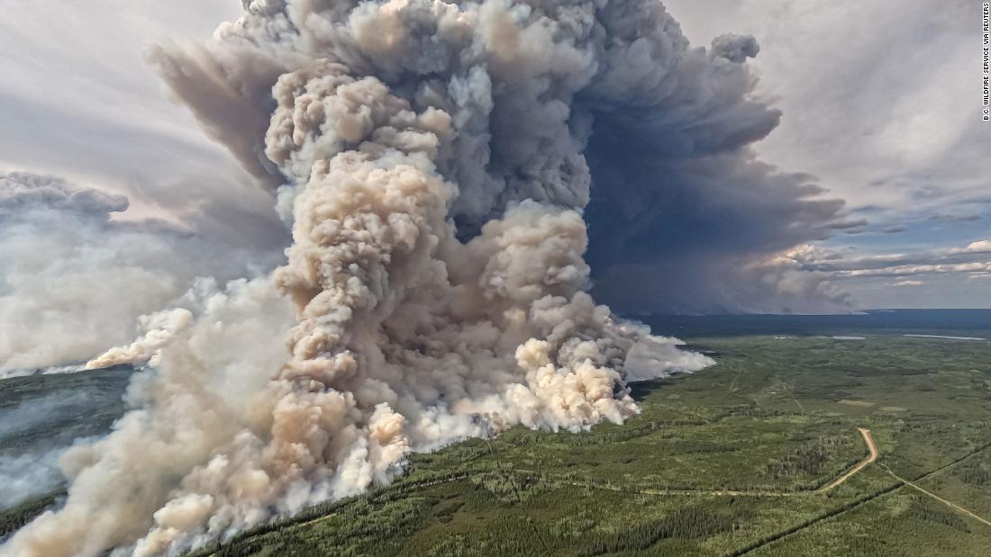 Smoke billows upwards from a planned ignition by firefighters who were tackling the Donnie Creek Complex wildfire south of Fort Nelson, British Columbia, on June 3.