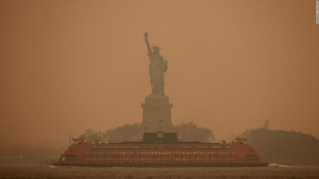 The Statue of Liberty is obscured by the air pollution in New York on June 6.