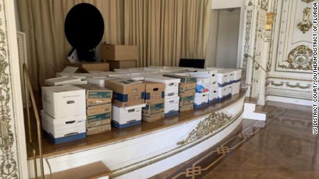 Boxes of classified documents are stored inside the Mar-a-Lago Club&#39;s White and Gold Ballroom in this photo included in Donald Trump&#39;s federal indictment.