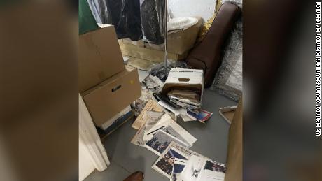 Boxes of spilled documents are seen on the floor, in this photo included in Donald Trump&#39;s federal indictment.

Credit: US District Court/Southern District of Florida
