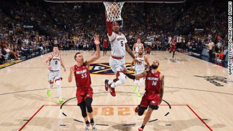 Kentavious Caldwell-Pope of the Denver Nuggets drives to the basket against the Miami Heat during Game Five of the 2023 NBA Finals on June 12, 2023 at Ball Arena in Denver, Colorado.