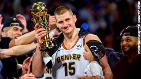 DENVER, CO - JUNE 12: Nikola Jokic (15) of the Denver Nuggets displays the NBA Finals Most Valuable Player Award as the star holds his daughter, Ognjena, after the fourth quarter of the Nuggets&#39; 94-89 NBA Finals clinching win over the Miami Heat at Ball Arena in Denver on Monday, June 12, 2023. (Photo by AAron Ontiveroz/The Denver Post)