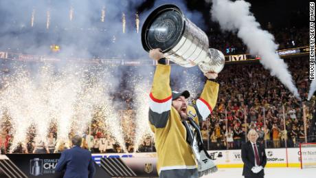 Mark Stone of the Vegas Golden Knights hoists the Stanley Cup after defeating the Florida Panthers to win the championship in Game Five of the 2023 Stanley Cup Final at T-Mobile Arena on June 13 in Las Vegas, Nevada. 