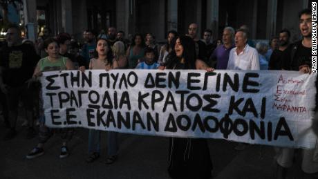 Kalamata residents, pictured on Thursday, take to the streets to protest government polices against migration.