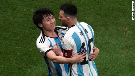 A Chinese fan runs onto the pitch to hug soccer superstar Lionel Messi during a friendly match between Argentina and Australia at the Worker&#39;s Stadium in Beijing on June 15.