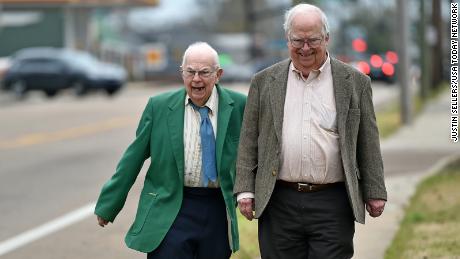 Brothers Donald, left, and Oliver Triplett take a walk in Forest, Mississippi.