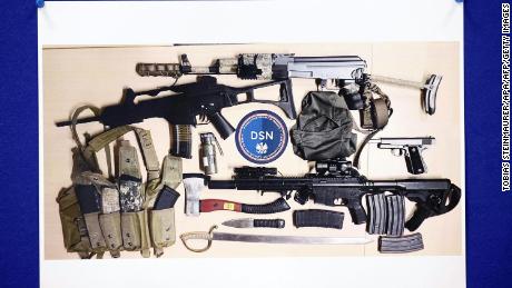 An image of the weapons confiscated is shown during the press conference. 