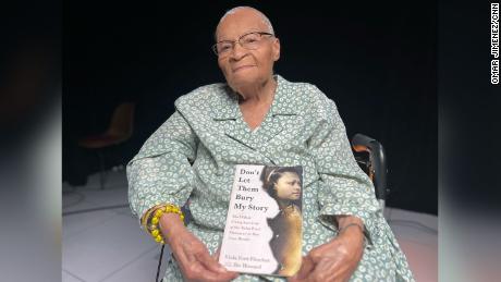 Viola &#39;Mother Fletcher&#39; Fletcher, 109, holds a copy of &quot;Don&#39;t Let Them Bury My Story,&quot; a memoir she cowrote with her grandson Ike Howard.