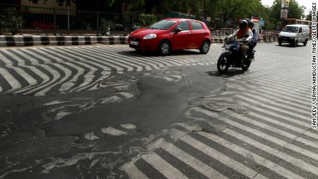 A road melts near Safdarjung Hospital in May 2015 after the temperature rose to about 113 degrees Fahrenheit in New Delhi, India. 