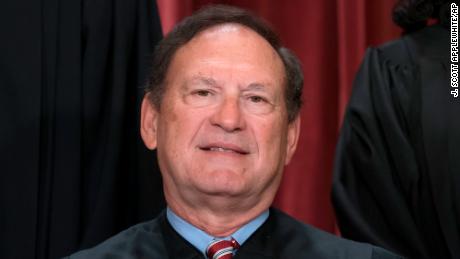 Associate Justice Samuel Alito joins other members of the Supreme Court as they pose for a new group portrait, at the Supreme Court building in Washington on October 7, 2022. 