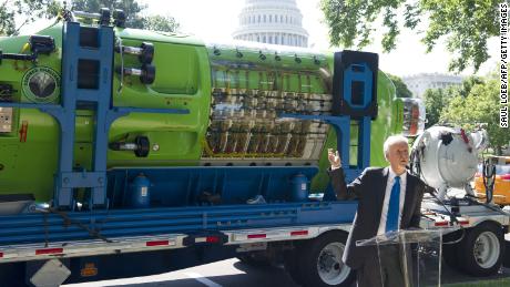 James Cameron speaks in front of the one-person submarine he helped develop, &quot;Deepsea Challenger,&quot; in 2013.