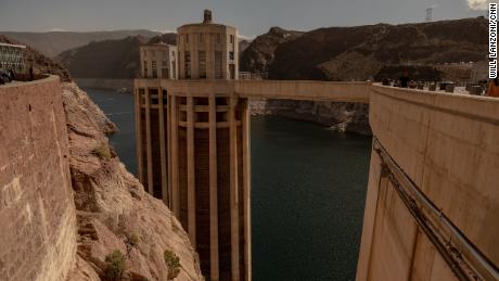 Intake towers for the Hoover Dam rise above the surface of Lake Mead in April 2023.