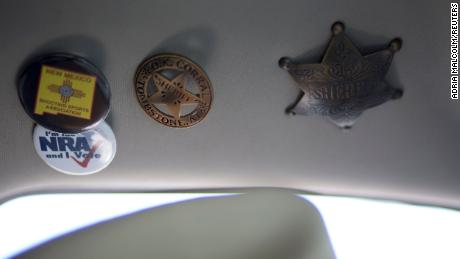 NRA and sheriff buttons are affixed to the roof of then-Sheriff Mace&#39;s truck in 2019.