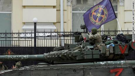 Members of Wagner group sit atop of a tank in a street in the city of Rostov-on-Don, southern Russia, on June 24, 2023.