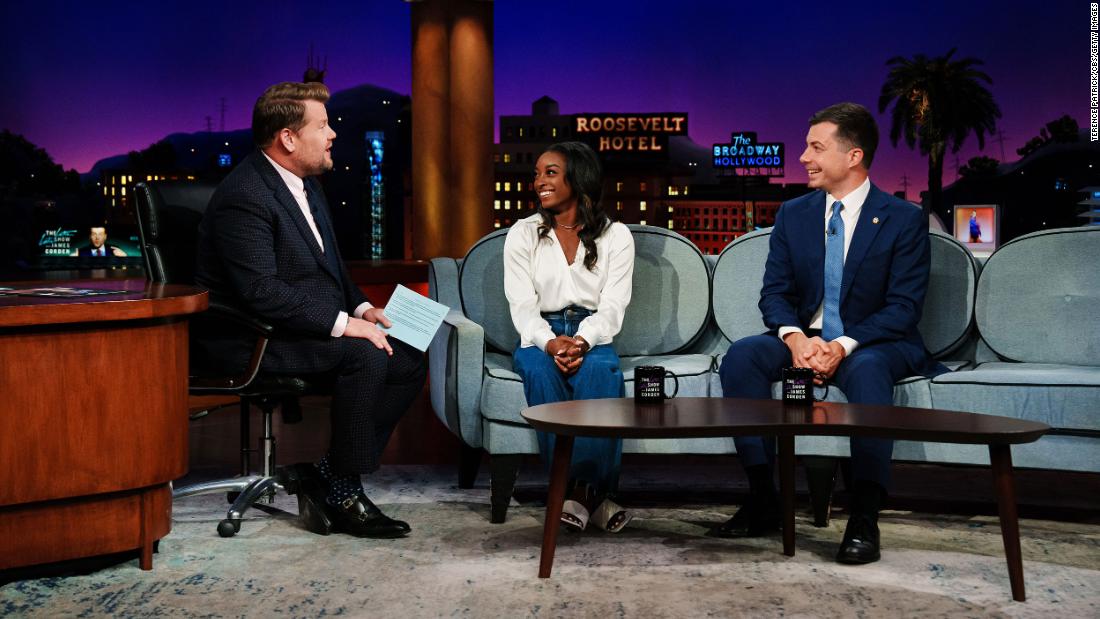 Biles appears on &quot;The Late Late Show with James Corden&quot; in September 2022. On the right is US Transportation Secretary Pete Buttigieg.