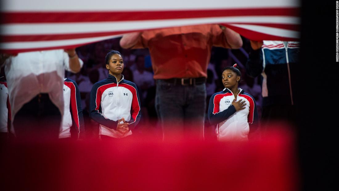 Biles, right, and fellow gymnast Gabby Douglas stand during the opening ceremony of the 2016 US Olympic Trials. Both made the team. Douglas was the Olympic all-around champion in 2012.