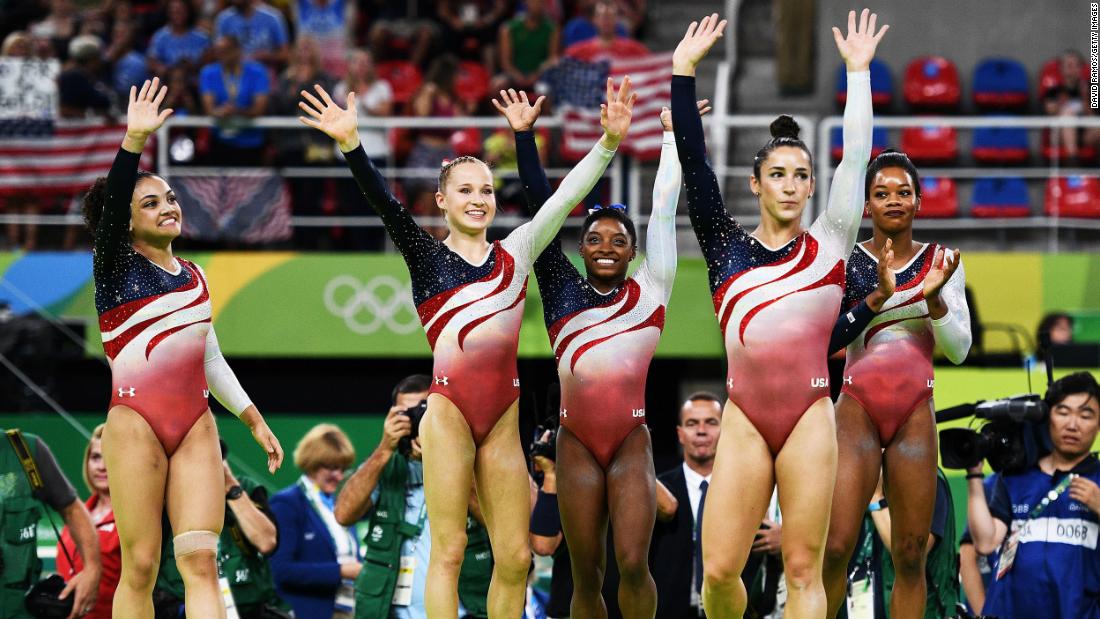 From left, US gymnasts Laurie Hernandez, Madison Kocian, Simone Biles, Aly Raisman and Gabby Douglas celebrate after winning gold in the team all-around at the 2016 Olympics.
