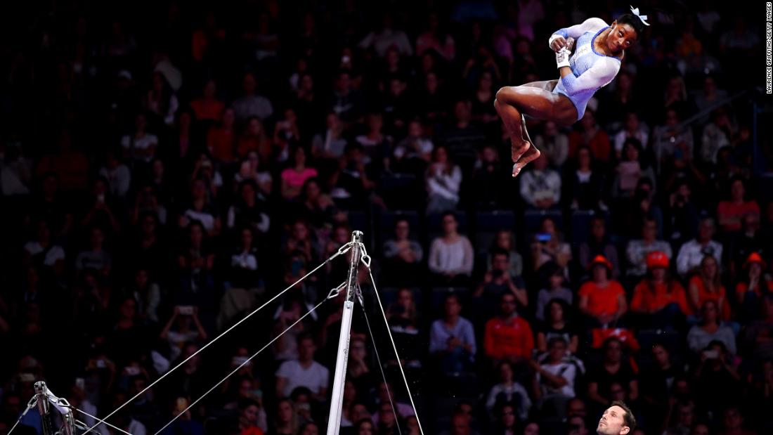 Biles soars through the air while competing on the uneven bars at the World Championships in 2019. Again, she won gold in the individual all-around.