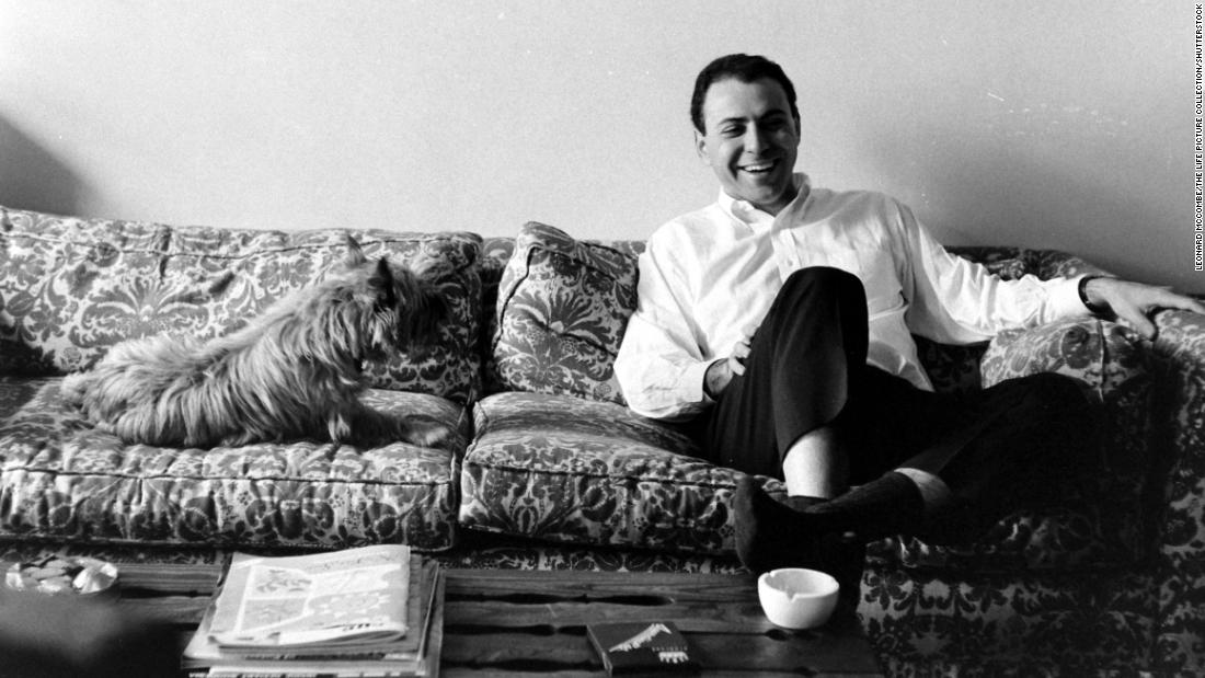 Arkin and a dog sit on a couch together in 1966. Arkin won a Tony Award for his Broadway debut in the 1963 play &quot;Enter Laughing.&quot;