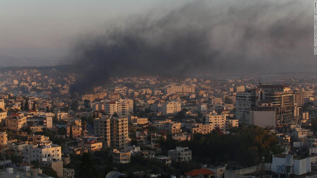 Smoke rises from buildings in Jenin on Monday.