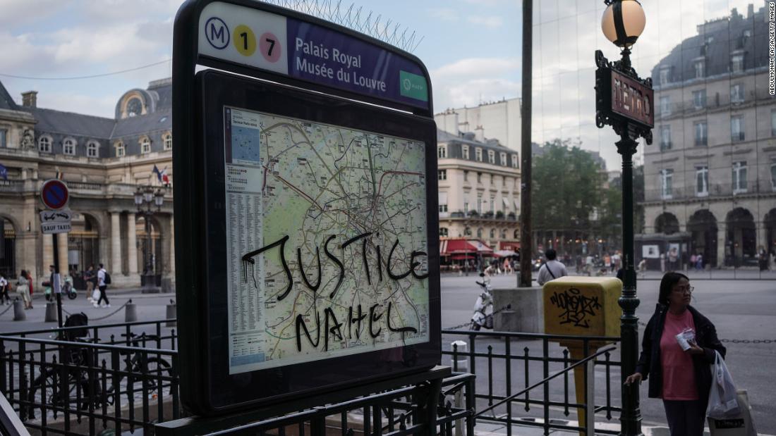 &quot;Justice Nahel&quot; is scrawled on a metro sign in Paris on July 2.