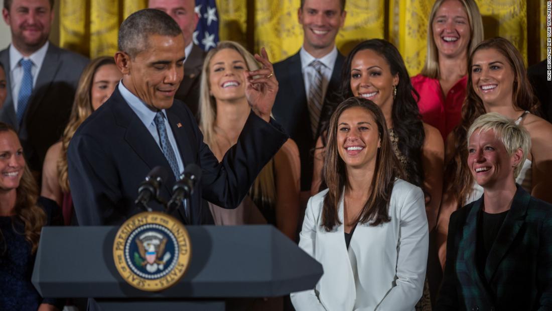 Rapinoe, far right, looks on with her teammates as then-President Obama welcomes them to the White House in October 2015. The visit was in honor of their World Cup victory.