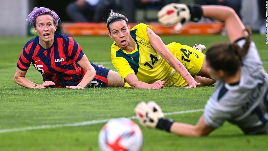 Rapinoe watches the ball with Australia&#39;s Alanna Kennedy during the bronze medal match of the Tokyo Olympics. Rapinoe scored two goals during the match, lifting her team to a 4-3 victory.