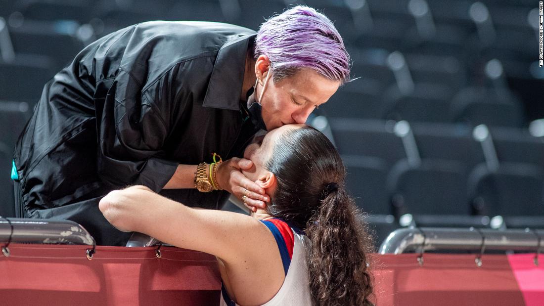 Rapinoe kisses her fiancée, American basketball player Sue Bird, after the United States defeated Japan in the women&#39;s basketball gold medal game at the Tokyo Olympics in August 2021. Rapinoe and Bird met at the 2016 Olympics and were engaged in 2020.