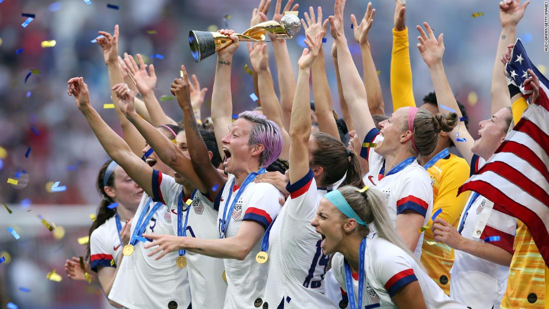 Rapinoe lifts the World Cup trophy while celebrating with her teammates following the United States&#39; victory over the Netherlands in 2019. 