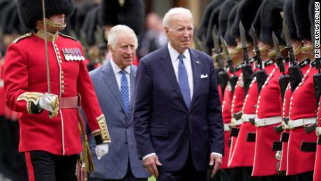 U.S. President Joe Biden and Britain&#39;s King Charles review an honorary guard at Windsor Castle in Windsor, England, Monday, July 10, 2023.  Kin Cheung/Pool via REUTERS