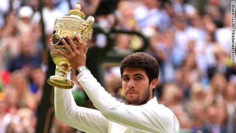 Carlos Alcaraz of Spain lifts the Men&#39;s Singles Trophy following his victory in the Men&#39;s Singles Final against Novak Djokovic of Serbia on day fourteen of The Championships Wimbledon 2023 at All England Lawn Tennis and Croquet Club on July 16, 2023 in London, England. 