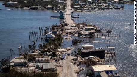 An aerial picture taken on September 30, 2022, shows the only access to the Matlacha neighborhood destroyed in the aftermath of Hurricane Ian in Fort Myers, Florida.