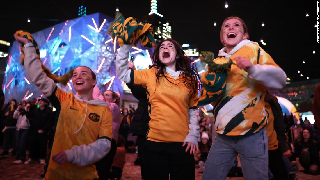 Fans in Melbourne celebrate as they watch the match between Australia and Ireland.