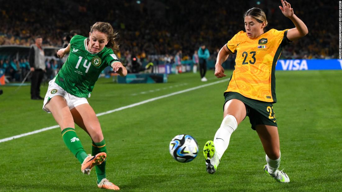 Ireland&#39;s Heather Payne, left, tries to cross the ball past Australia&#39;s Kyra Cooney-Cross. This was Ireland&#39;s first-ever match in a Women&#39;s World Cup.