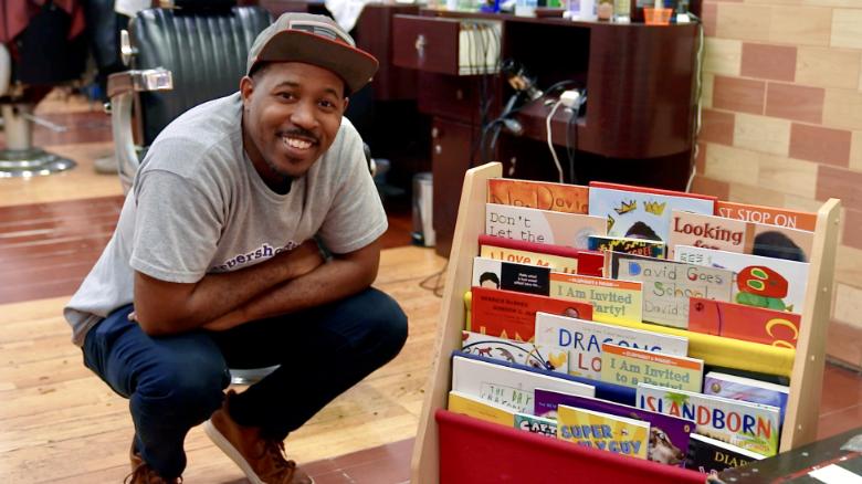 Fresh looks and new books: He's helping young boys hone their love of reading every time they go to the barbershop