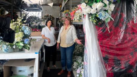 Corri Levelle, owner of Sandy Rose Floral, shows CNN around her warehouse on June 28.