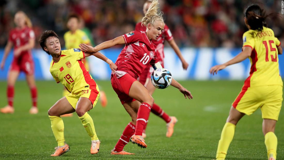 China&#39;s Zhang Linyan competes for the ball with Denmark&#39;s Pernille Harder.