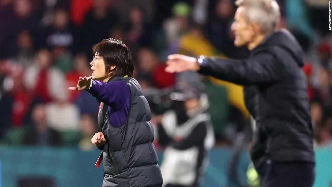 China head coach Shui Qingxia gestures during the match.
