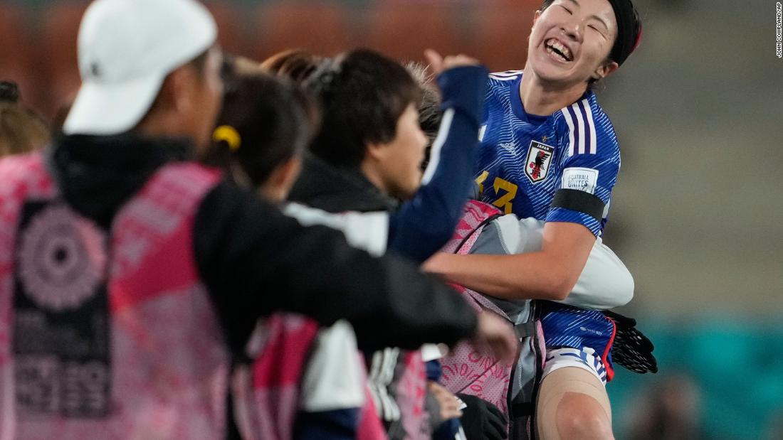Japan&#39;s Jun Endo celebrates with her bench after scoring her team&#39;s fourth goal in a 5-0 win against Zambia on July 22.