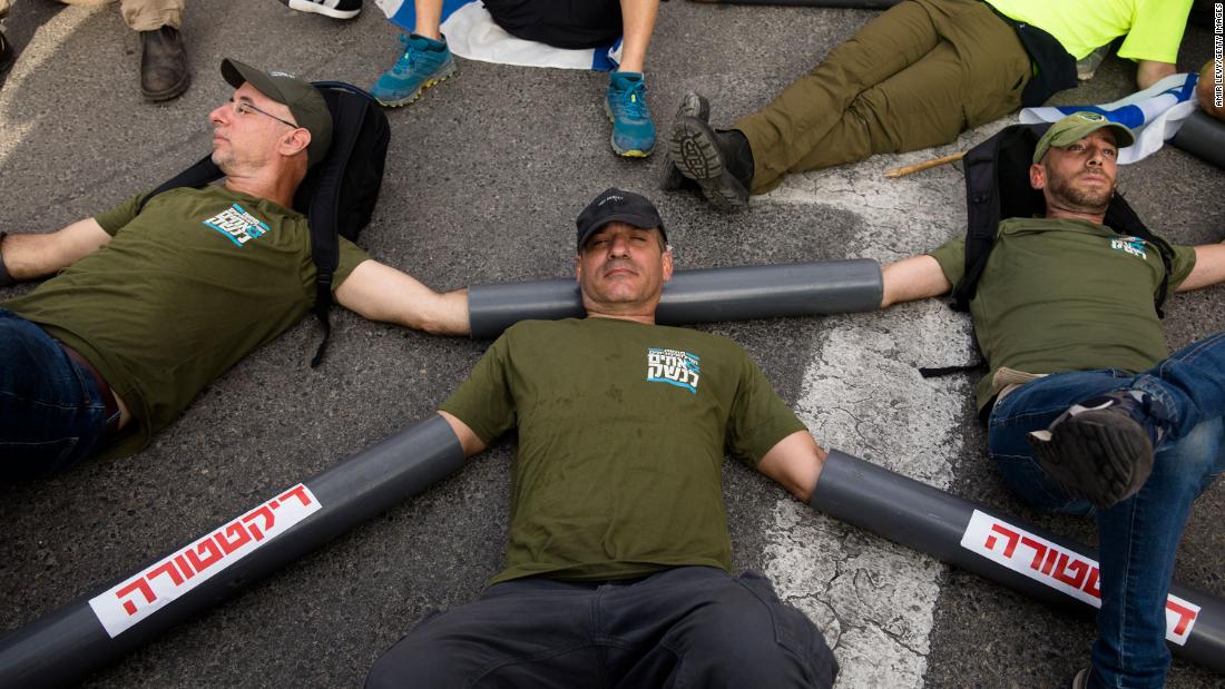 Protesters block the main entrance to the Ministry of Defense during a protest in Tel Aviv on July 18.