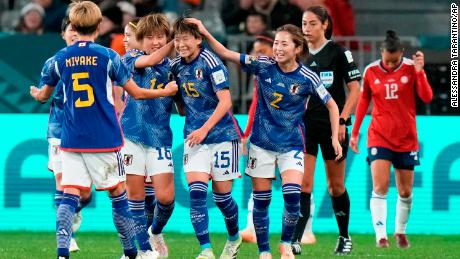 Fujino (middle) is congratulated by her teammates after scoring Japan&#39;s second goal against Costa Rica.