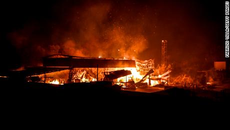 An abandoned shed engulfed in flames in the province of Catania, Italy, on Tuesday.